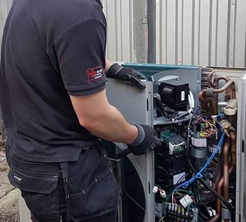 air conditioning expert repairing unit